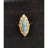Finger ring of navette shape with 'Matrix' turquoise in gold 'K 18'. Size 'O'.