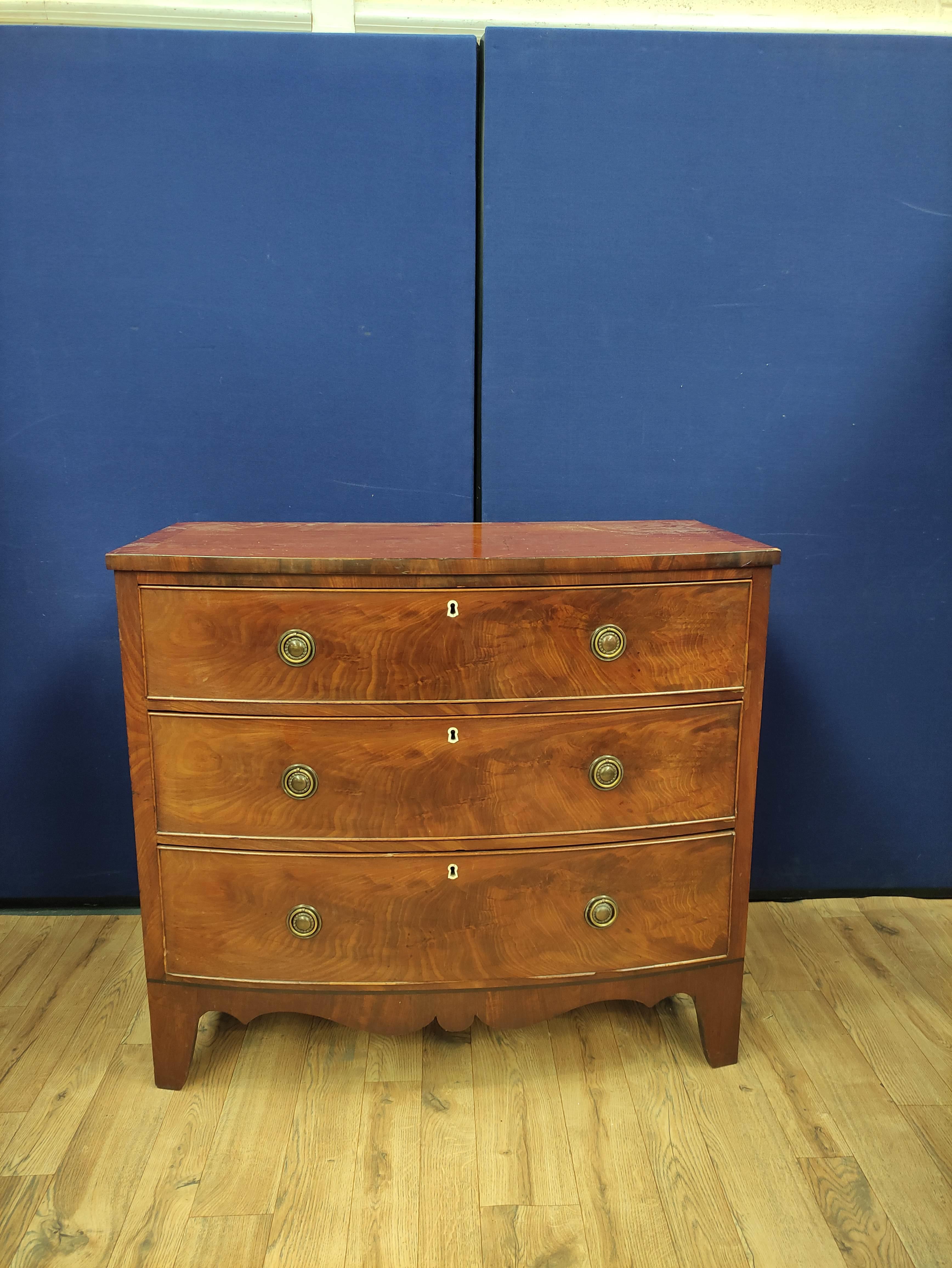 Georgian mahogany chest of drawers circa early 19th century, with three long drawers raised on