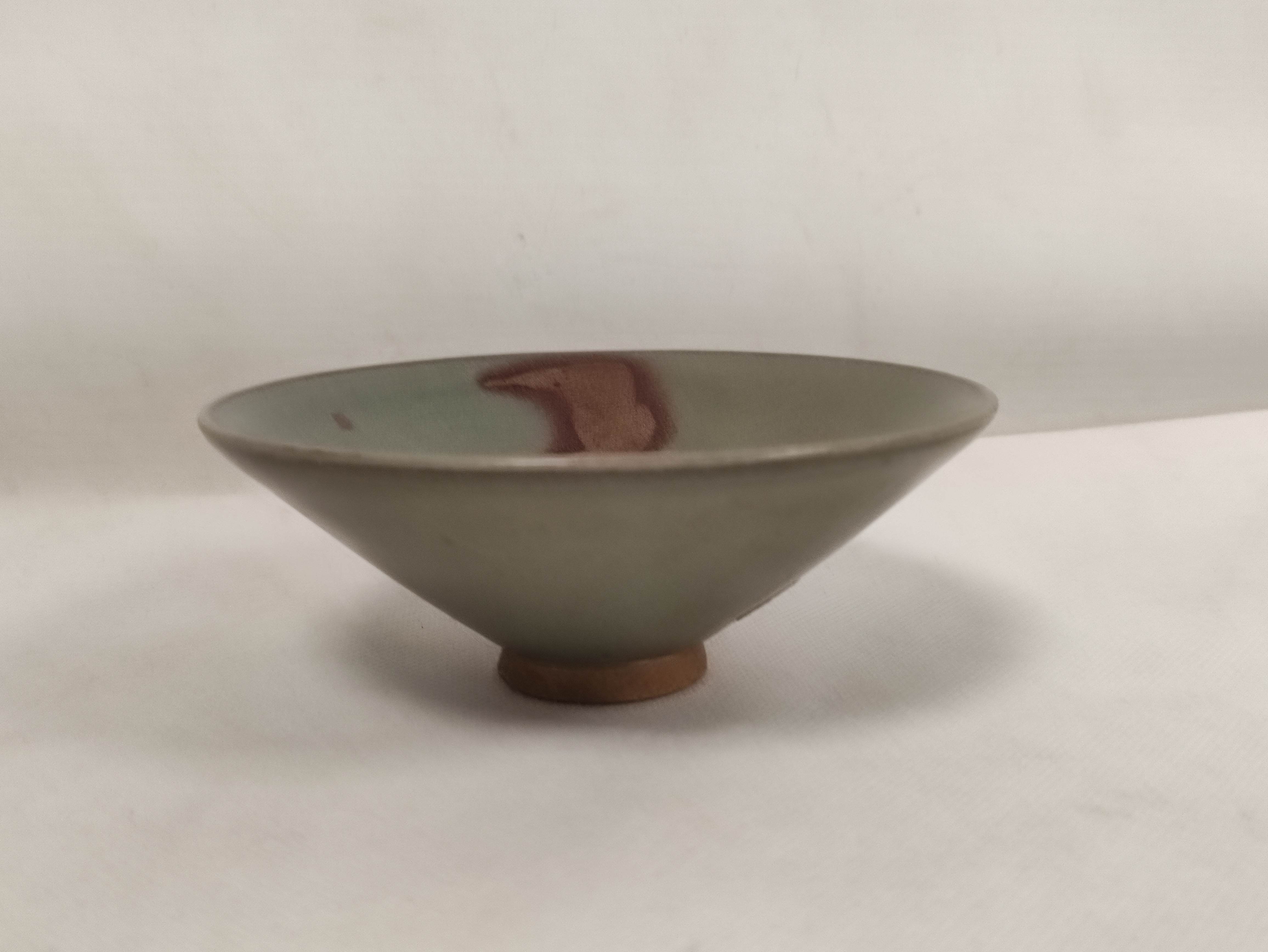 Chinese Junyao ware bowl in the Song dynasty style with purple splashes on a grey green ground.