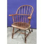 West Country style ash and elm Windsor armchair, 19th century, with a spindle hoop back. 93cm wide.