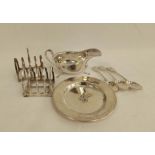 Silver circular dish, two individual toast racks, two tea spoons, 1870, another e.p. and a similar