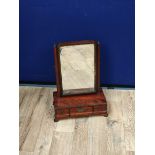 Georgian mahogany dressing glass, the swing mirror above a central drawer flanked with a small