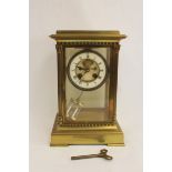 French mantel clock of 'four glass' style with visible escapement, 'mercury' pendulum and fluted
