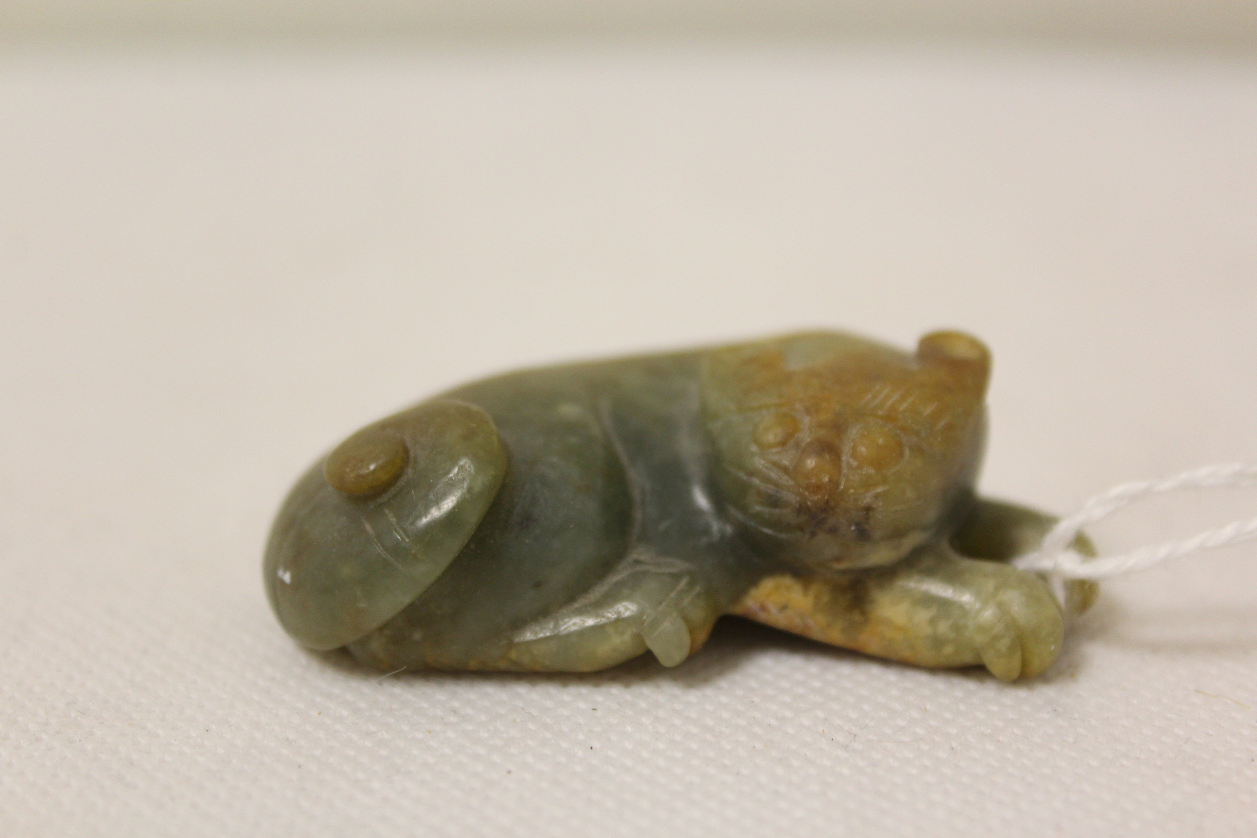 Three Chinese archaic and archaised jade figures to include a repose cat figure, a rectangular - Image 2 of 14
