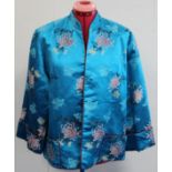 Vintage Chinese lady's jacket in turquoise floral brocade with red piping, retailed by Debenham