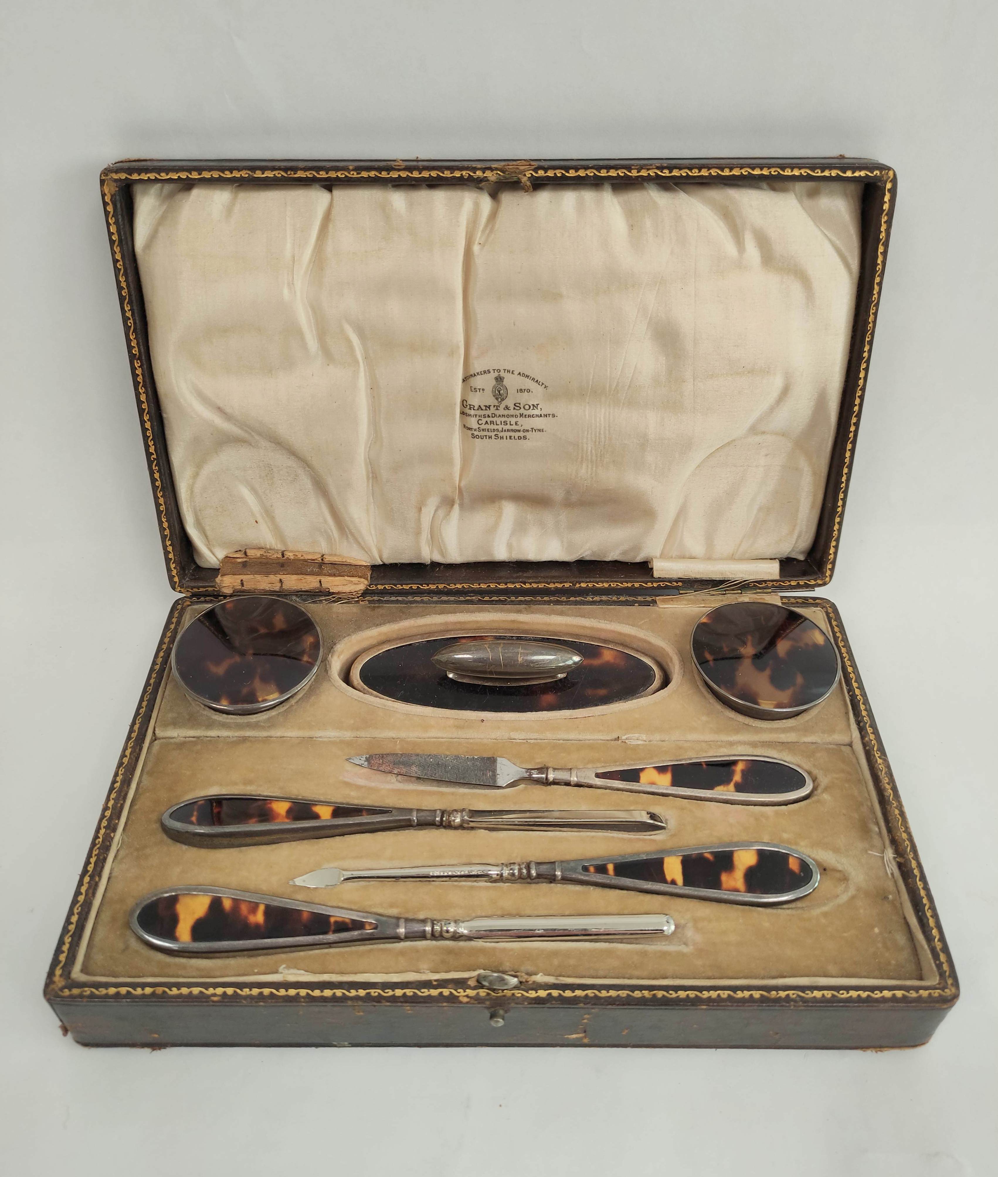 Silver mounted tortoiseshell manicure set in fitted case, Chester 1922, for Grant Castle.