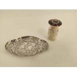 Silver mounted smelling salts bottle, Birmingham 1920, and an embossed pin tray of lobed oval