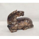 Large Chinese grey and brown hardstone carving of a reclining horse, 14cm high, 19cm long.