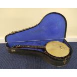 Four string banjo by Reliance in fitted case