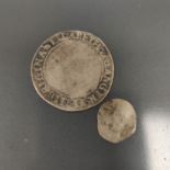 England. Two Elizabeth I silver hammered coins to include a defaced 1560-1 London mint shilling with