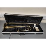 Brass students slide trombone by Gear 4 Music, with accessories in plush velvet interior hard case.