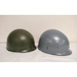 Two late 20th century Dutch M53 inner helmets of both with liners. All plastic construction one