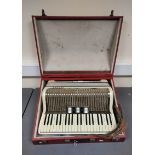 Vintage Hohner accordion, in white pearloid finish. In hard carry case.