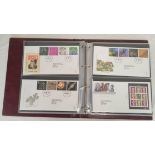 Album of approximately 56 Royal Mail first day cover postage stamp sets dating from 1998-2000. All