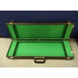 Vintage violin bow case with fitted green plush interior with compartments for twelve bows
