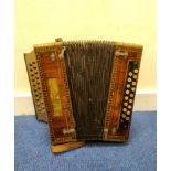 Antique button box melodeon by Stradella Italy, with the Stradella bass key configuration, wooden