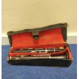 Antique pre 1930 Boosey & Co dark rosewood clarinet, serial no. 16316, in defective leather case.