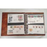 Album of approximately 48 Royal Mail first day cover postage stamp sets dating from 1982-1985. All