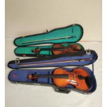 Two modern 3/4 size student violins in fitted hard cases one by Lark the other of Hungarian