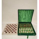 Hardstone chess set in plush green velvet case