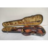 A fine antique 4/4 violin in fitted case bearing a label for Jacobus Stainer 1660 with two piece