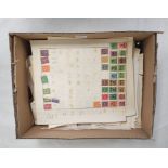 Box of collector's postage stamps containing pages from a stamp album to include early Irish