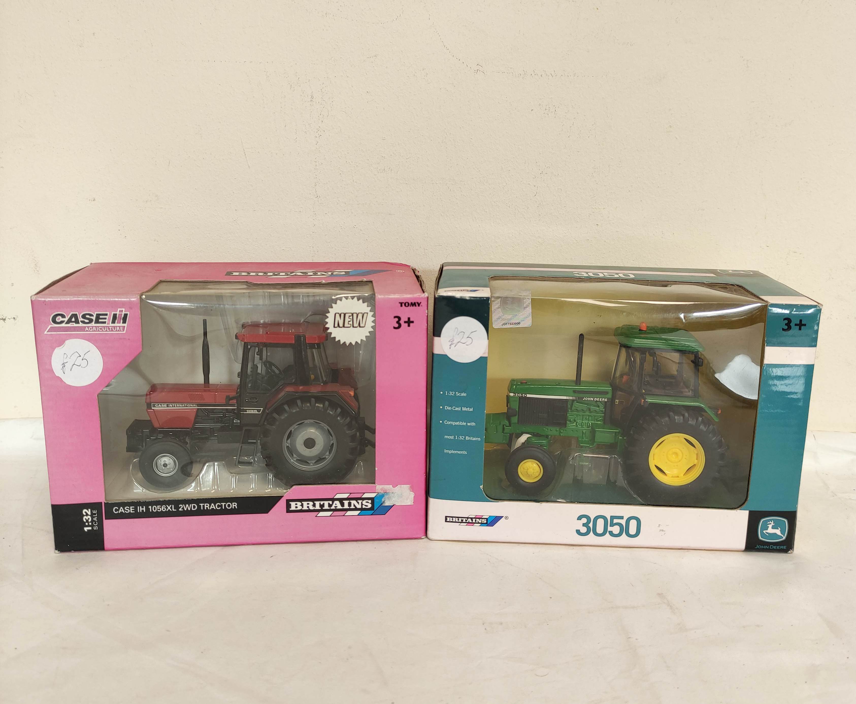 Two boxed 1:32 scale Britains model tractors to include John Deere 3050 42902 & a Case IH 1056XL 2WD