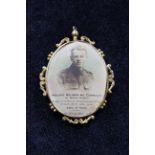 WW1 mourning pendant with embroidered floral decoration, the reverse bearing a photograph