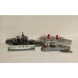 Collection of 1940s homemade model boats to include a painted exploding wooden model boat, a