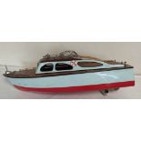 Vintage wooden painted model boat with electric motor.