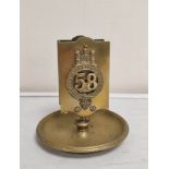 WW1. Brass trench art vesta holder and ashtray bearing the crest of the Suffolk Regiment 58th