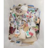 Box containing a large quantity of world postage stamps to include pages from a collector's album