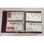 Album of approximately 96 Royal Mail postage stamps and first day cover sets dating from the 1970s-