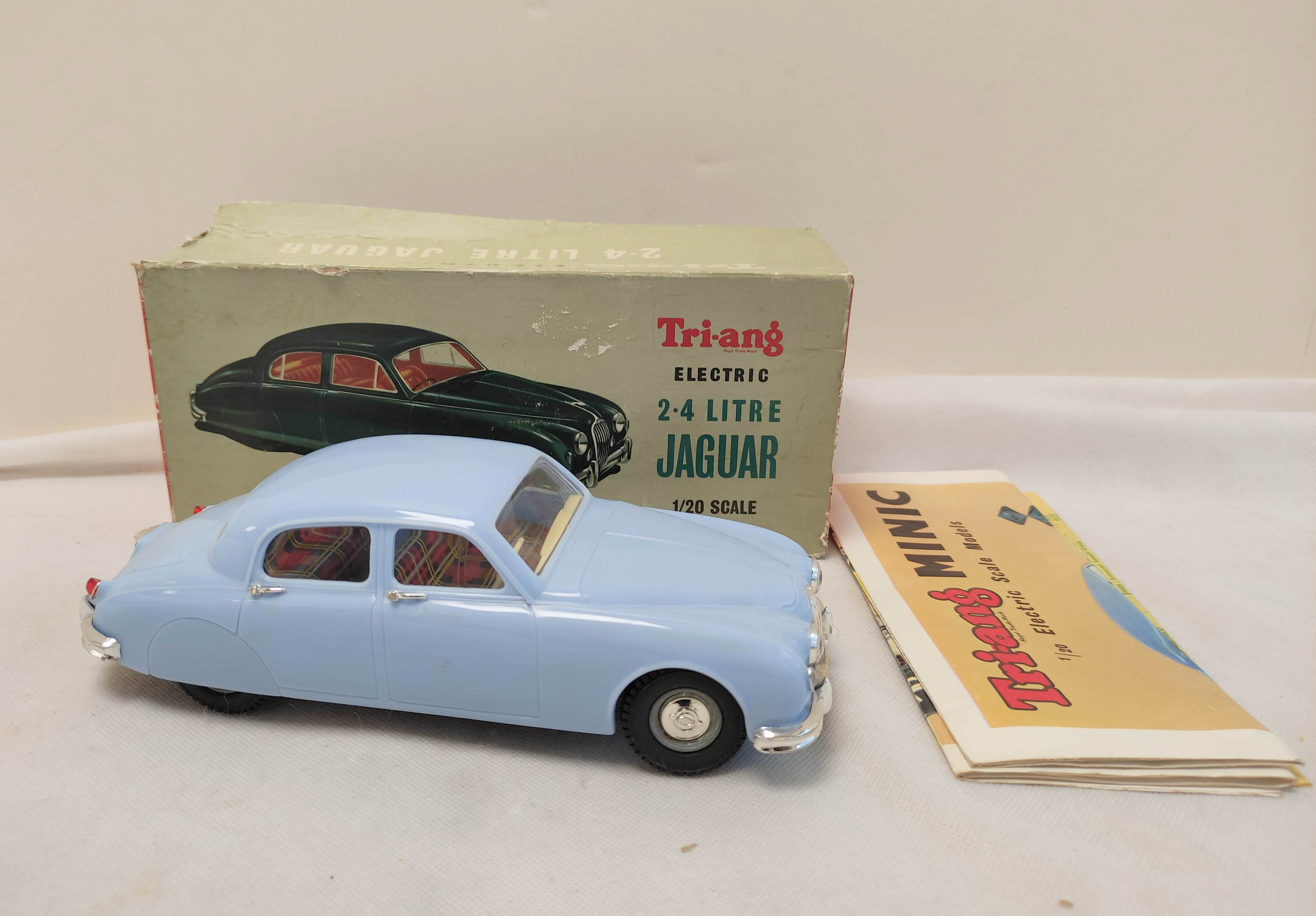 Tri-ang 1/20 scale Electric 2.4 Litre Jaguar in sky blue paint. Original box present but bashed