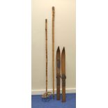 A pair of 1930s mountaineering skis by Staub & Cie Zurich. Teak skis with two bamboo poles.