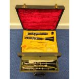 Two antique cased clarinets, the first by Boosey & Hawkes with nickel plated keys, the second by