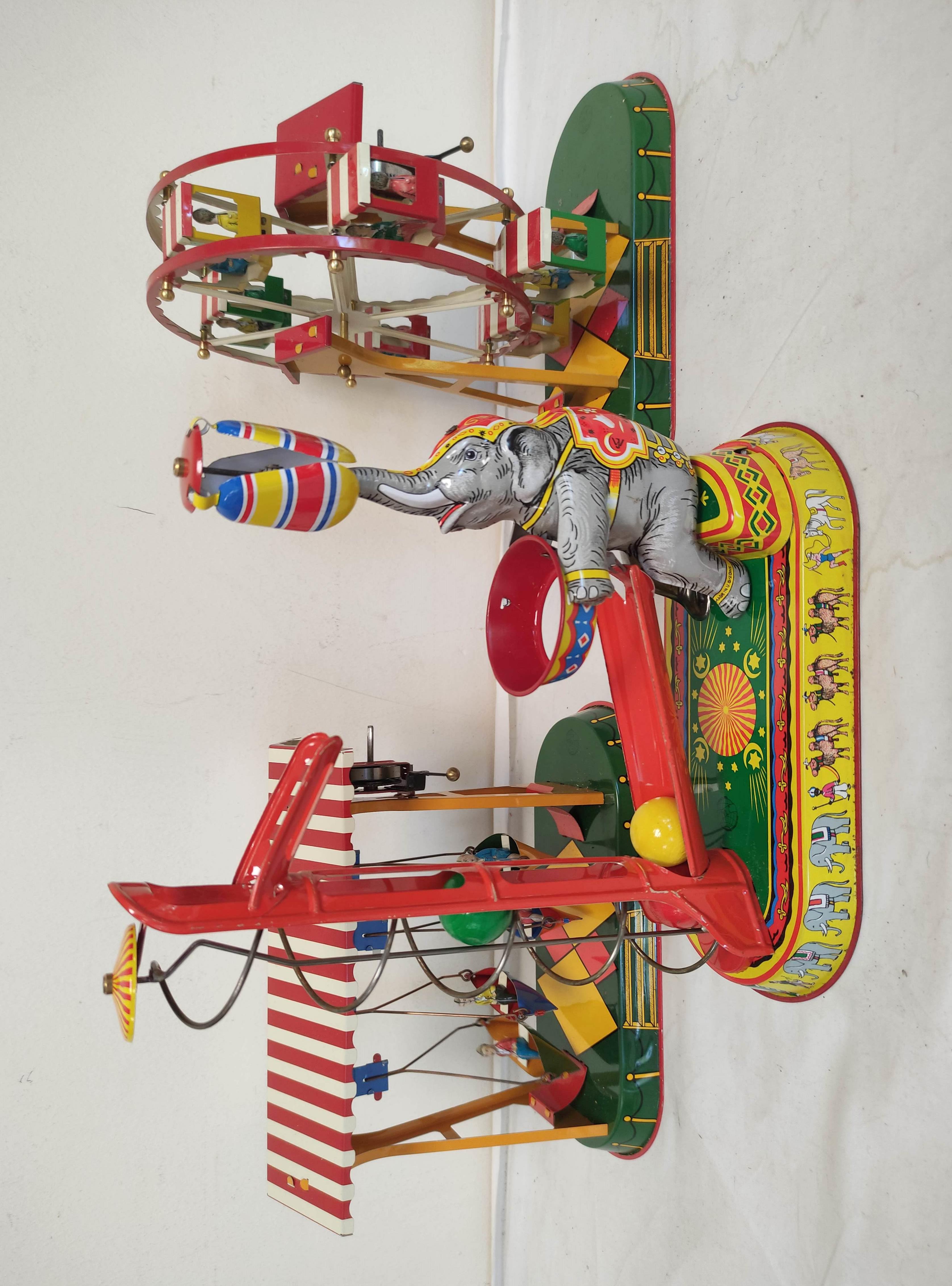 Three German vintage mechanical clockwork circus themed tin toys by Josef Wagner to include a ferris