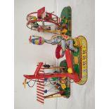 Three German vintage mechanical clockwork circus themed tin toys by Josef Wagner to include a ferris