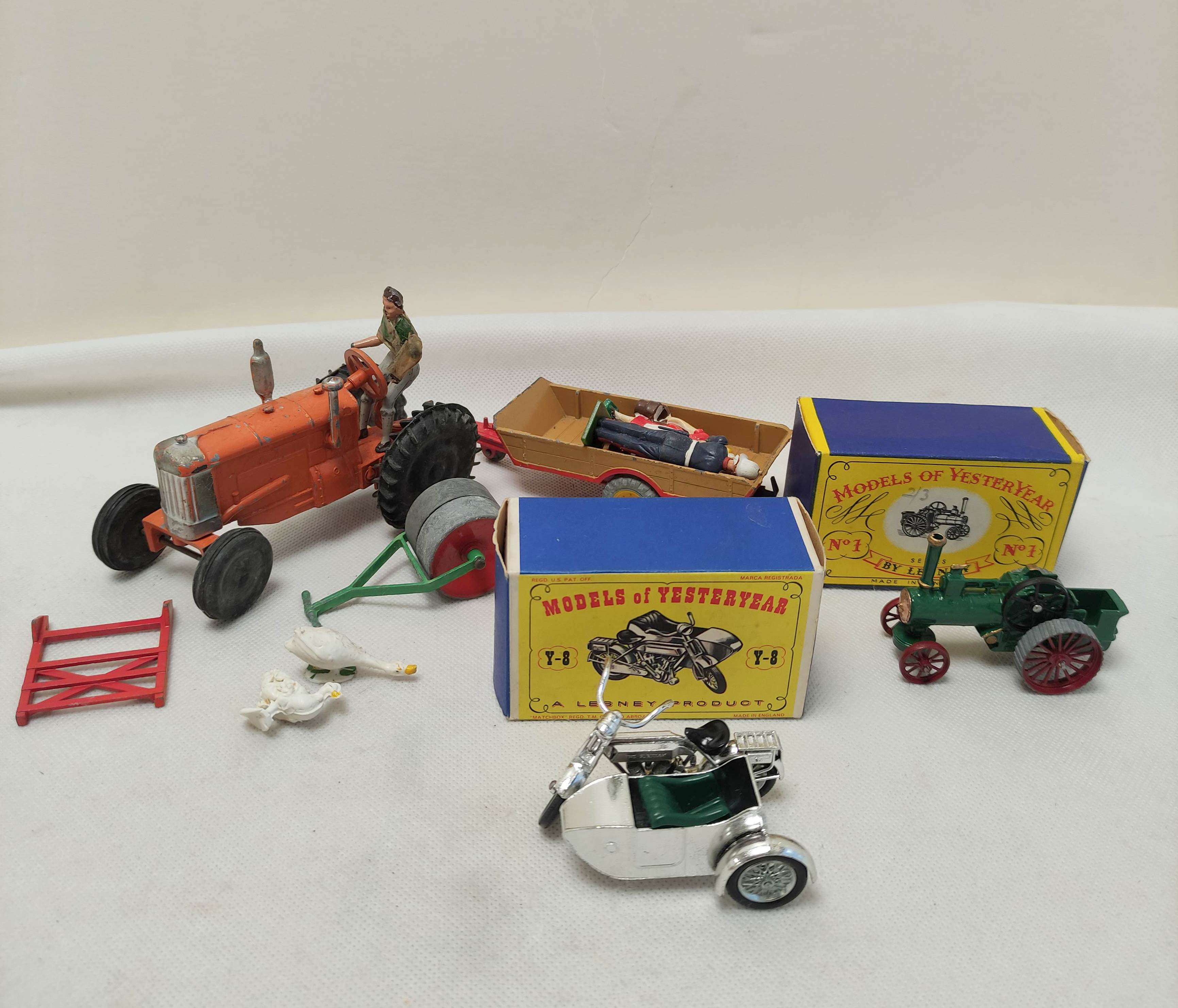Vintage die cast toy lot to include a tractor with Dinky trailer & two boxed Lesney Models of