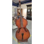 Vintage double bass 198cm high on wooden stand. In need of some attention.