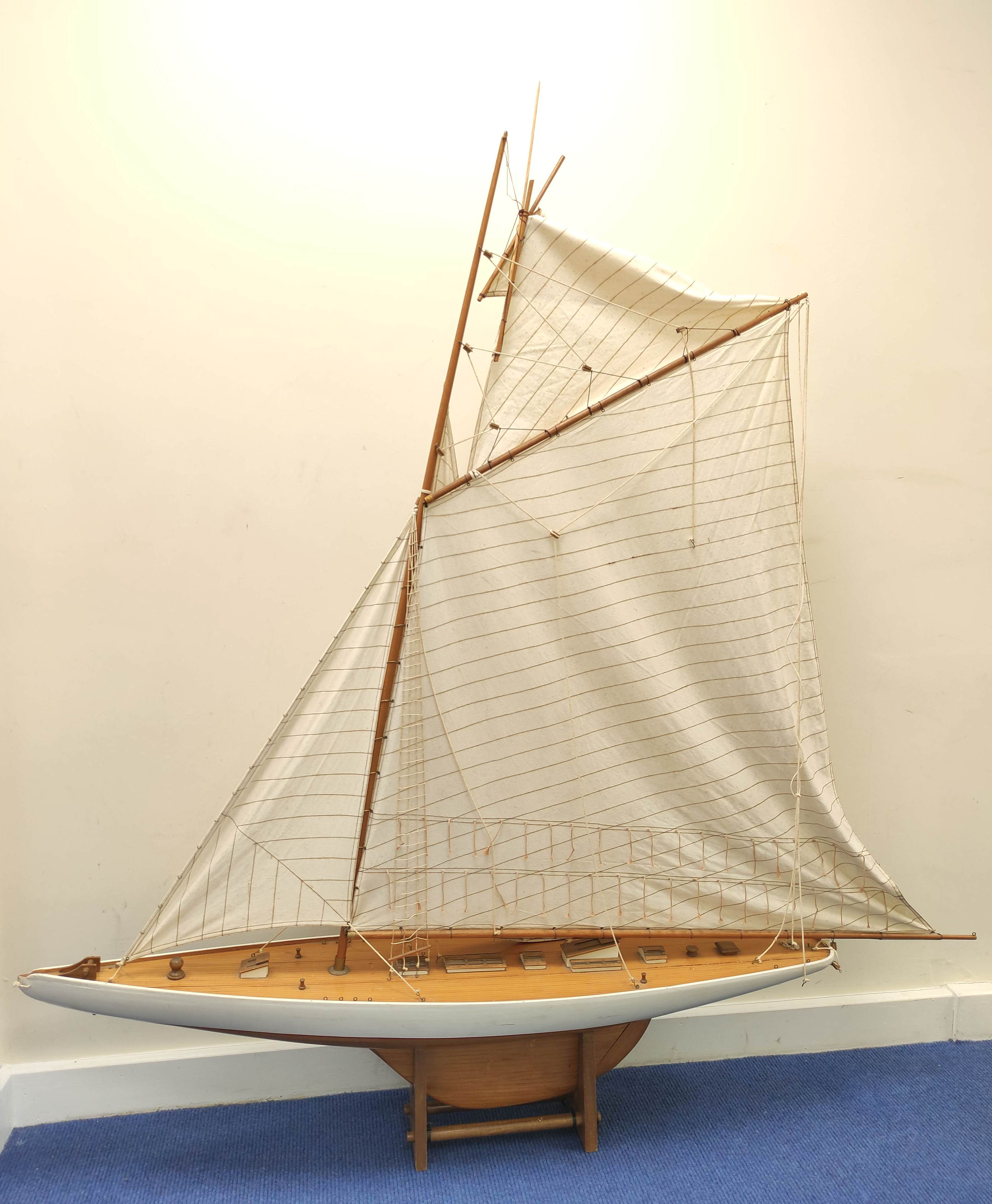 Large model sailing ship by Nauticalia of London with wooden hull and canvas sails.