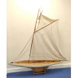Large model sailing ship by Nauticalia of London with wooden hull and canvas sails.