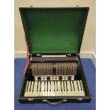Vintage Hohner VM accordion in hard carry case, with faux ivory keys.