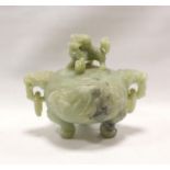 Chinese green hardstone koro with twin mask-head ring handles, carved panels of prunus and lotus, on