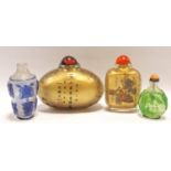 Chinese green overlay glass snuff bottle of pear form decorated with birds and pagodas, with twin