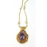 Amethyst crystal in 9ct gold twiggy pendant mount, on similar necklet.