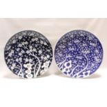 Two Chinese blue and white porcelain chargers of circular form, decorated with prunus blossom,