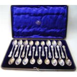 Set of twelve silver teaspoons with scroll borders with six matching coffee spoons, by The