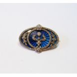 Victorian gold oval brooch with ovals, sprays and collets of rose and brilliant diamonds upon blue