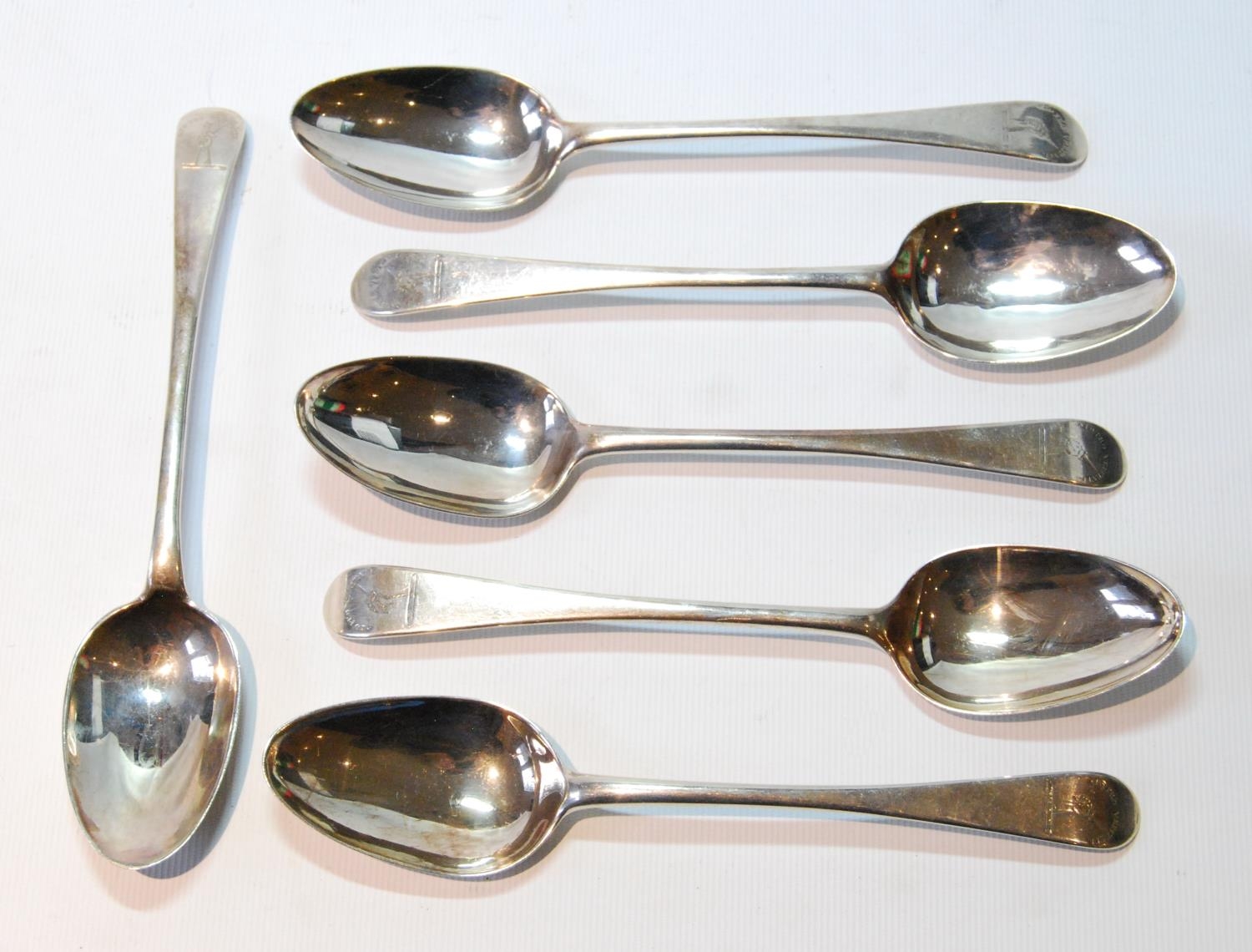 Set of five silver dessert spoons, crested, by W Scott, Dundee, and a French one to match, 191g or